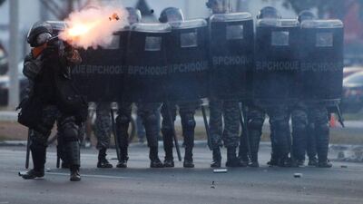 Policemen clash with demonstrators in Brasilia, Brazil. Police in Brazil used mounted policemen and tear gas at a demonstration of almost 2000 participants close to the stadium in Brasilia, where World Soccer Cup trophy is exhibited for visitors. Fernando Bizerra / EPA