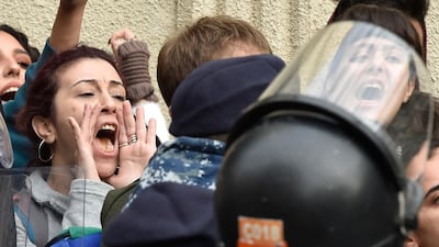 Anti-government protesters shout slogans during a protest near a barracks where 59 protesters are detained following overnight clashes near Lebanese Central Bank in Beirut, Lebanon, 15 January 2020. EPA