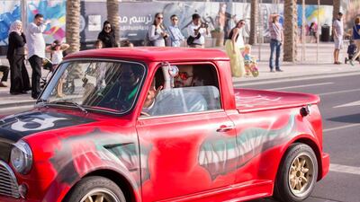 Cars decorated with the UAE flag joined the bands, dancers and entertainers as part of the procession