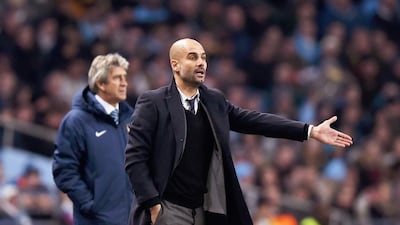 If Manchester City look to replace Manuel Pellegrini, behind, Pep Guardiola, front, could be a strong choice to replace the manager. Laurence Griffiths / Getty Images