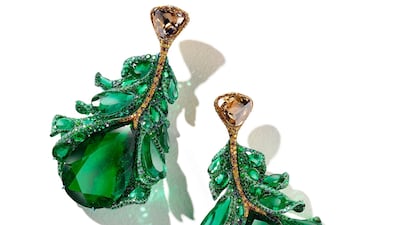 Green Plumule Earrings: The matching earrings feature two large Colombian emeralds, as well as two briolette-cut brown diamonds.