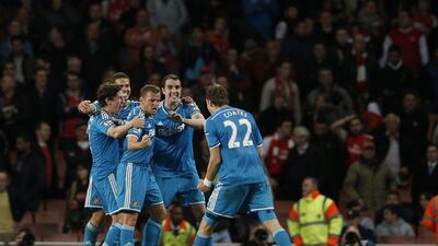 Sunderland players celebrate at the final whistle of their Premier League 0-0 draw against Arsenal on Wednesday night as they mathematically avoided relegation. Adrian Dennis / AFP / May 20, 2015