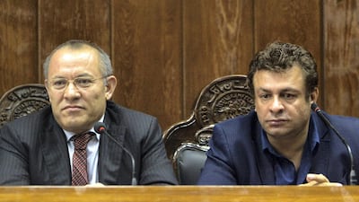 Kabul Bank Chairman Sherkhan Farnood (L) and Kabul Bank CEO Khalilullah Ferozi listen during a news conference in Kabul September 1, 2010. Reuters