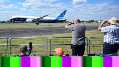 A Boeing 787-9 aircraft lands after a flight demonstration. Carl Court / AFP