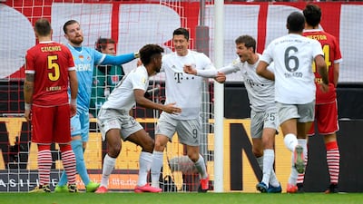Bayern Munich's Kingsley Coman, third left, celebrates after scoring. AFP
