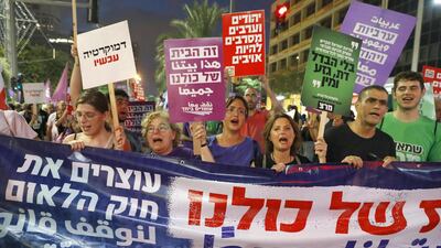Demonstrators attend a rally to protest against the 'Jewish Nation-State Bill' in the Israeli coastal city of Tel Aviv. Jack Guez / AFP