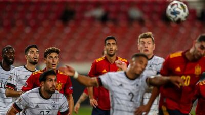 Germany and Spain players compete for the ball. AP Photo