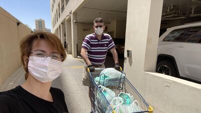 Loreli and John Cowling are part of a Dubai badminton group who have organised the delivery of essential food supplies to struggling families. Courtesy: Dubai Badminton Together Against Covid 19