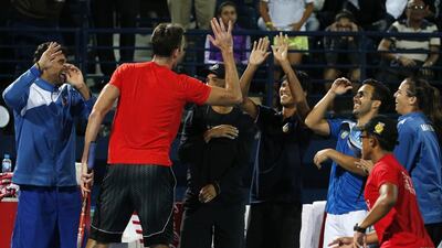 Croatia's Ivo Karlovic of Philippine Mavericks celebrates winning against Switzerland's Roger Federer of Obi UAE Royals during their International Premier Tennis League (IPTL) tennis match on December 14, 2015 in the Emirate Dubai. AFP PHOTO / KARIM SAHIB