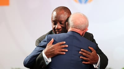 The South African leader hugs Mr da Silva. EPA