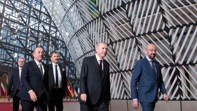 EU Council President Charles Michel (R) with Turkish President Erdogan (C) and Turkish Foreign Minister Mevlut Cavusoglu (L) attend their meeting at the European Council in Brussels. EPA