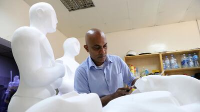 Sculptor Mark Ranasinghe crafts giant Oscar sculptures out of polystyrene. Chris Whiteoak / The National