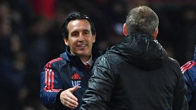 Arsenal's head coach Unai Emery shakes hands with Manchester United's manager Ole Gunnar Solskjaer after the match. AFP