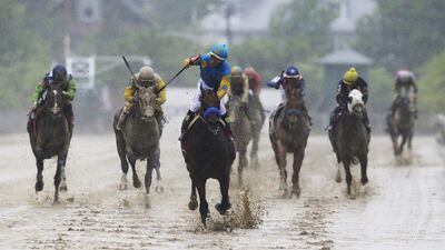 American Pharoah, centre, ridden by Victor Espinoza, wins the 140th Preakness Stakes horse race at Pimlico Race Course on May 16, 2015, in Baltimore. Patrick Semansky / AP Photo