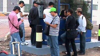 Some members of the crew of the Vietnamese state owned ship Diamond Way attempt to leave Jebel Ali Port on December 2nd, 2012. The ship cannot leave the UAE because it owes more than Dh294,000 in berthing charges to Jebel Ali Port authorities. The ship's 19 sailors, who have not received salaries for several months, have been stuck on the vessel since August 1.