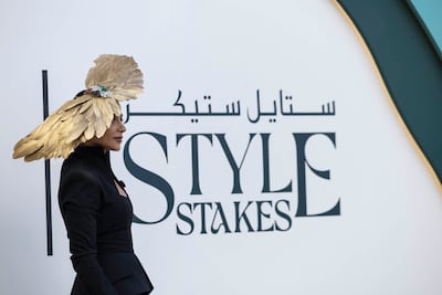 Fashionable racegoers take part in the Style Stakes competition at Meydan Racecourse during the Dubai World Cup. Antonie Robertson/The National