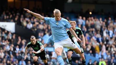 Erling Haaland scores from the penalty spot. Getty