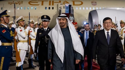 Sheikh Mohamed is welcomed by Yin Hejun, China's Minister of Science and Technology, at Beijing Capital International Airport.