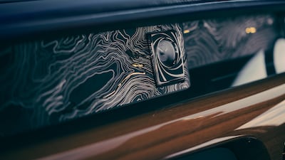 It takes inspiration from both the original car and the film itself, with hand-painted topography designed to resemble the mountains where Bond tracked Goldfinger in the film, as well as a clock with the trademark Bond gun barrel. Photo: Rolls-Royce Motor Cars