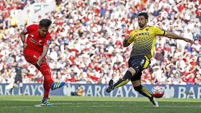 Roberto Firmino scores the first goal for Liverpool. Phil Noble / Reuters