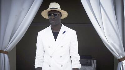 A simple look, finished off with a surprise: that handsome lapel accessory.