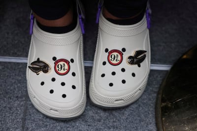 A Harry Potter fan wears themed Crocs on Back to Hogwarts Day. Reuters
