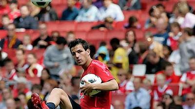 Cesc Fabregas, shown at an open training session this week at the Emirates Stadium, says he is staying at Arsenal.
