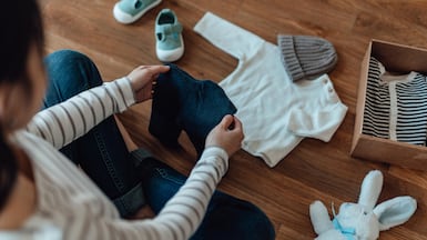 Shopping is one tangible thing parents-to-be can take control of ahead of their new arrival, but the tendency to over-buy is common. Getty Images