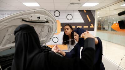 The women are given practical advice such as checking oil levels in the engine. Ahmed Jadallah / Reuters