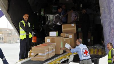 Emergency medical aid supplied by the ICRC and UNICEF is unloaded at Sanaa International Airport on April 10, 2015. Yahya Arhab/EPA