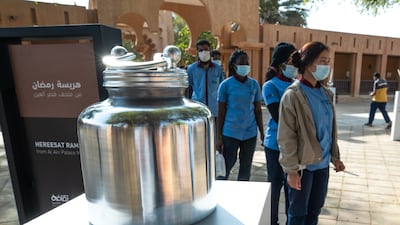 A container of ghee on display. Ghee is poured over the harees to finish off the dish.