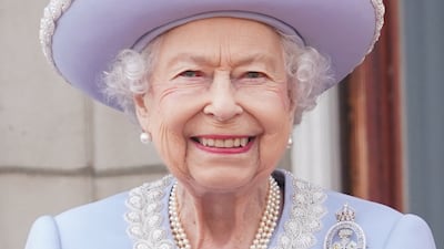 Britain's Queen Elizabeth II stands on the balcony of Buckingham Palace as troops march past during her birthday parade. Pool / AFP