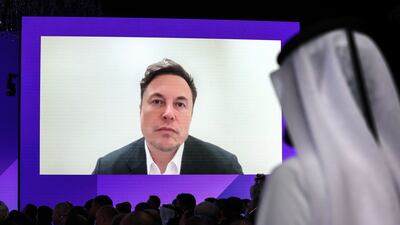Mr Musk answers questions at the Qatar Economic Forum. Bloomberg