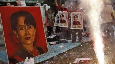 Supporters of Myanmar's pro-democracy leader Aung San Suu Kyi celebrate in New Delhi after her release from house arrest.