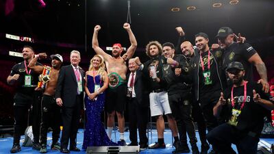 Tyson Fury poses for a photograph with promoters Frank Warren and Bob Arum, trainer SugarHill Steward, wife, Paris and team during a press conference after Fury won the fight against Deontay Wilder. Reuters