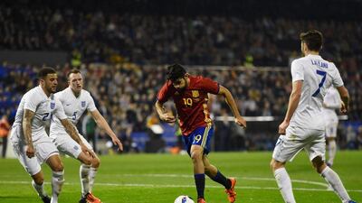 Diego Costa of Spain takes on Kyle Walker, Phil Jones and Adam Lallana. Mike Hewitt / Getty Images