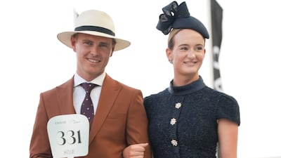 A couple walk the judging catwalk at the Dubai World Cup Style Takes 2025. Photo: Dubai Racing Club