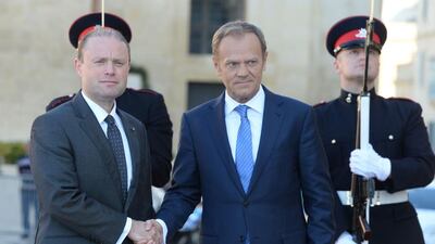 The EU president Donald Tusk, right, is welcomed by Maltese prime minister Joseph Muscat as he arrives in St Julian’s Malta on March 31, 2017 to announce the bloc’s stance on negotiations for Britain’s withdrawal. Matthew Mirabelli / AFP