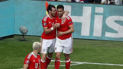 Wales' Hal Robson-Kanu, right, celebrates with his teammate Gareth Bale, left, after scoring in their team's win over Slovakia at Euro 2016 on Saturday. Hassan Ammar / AP / June 11, 2016