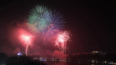 Fireworks illuminate the sky over Hoan Kiem Lake during the New Year's Eve celebrations in Hanoi, Vietnam. EPA