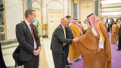 Prince Mohammed greets officials.