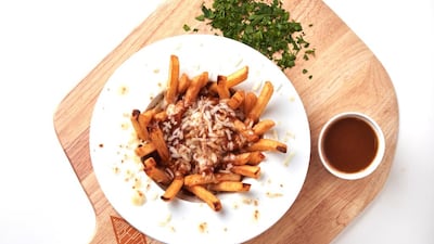 A handout photo of Canadian Classic poutine (Courtesy: House of Pizza)