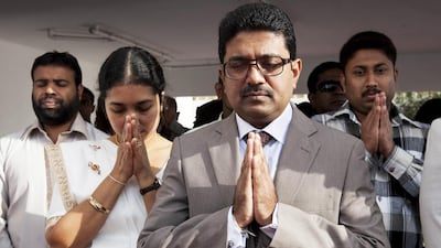 Sri Lankan expats pray at a ceremony held to mark the 66th Sri Lankan Independence Day at the Consulate in Bur Dubai. Razan Alzayani / The National