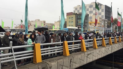 People stand in the street to show their protest against increased gas price in Tehran, Iran on November 16, 2019. WANA (West Asia News Agency) via Reuters