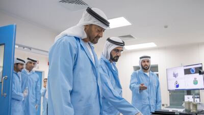 Sheikh Mohammed bin Rashid, Vice President and Ruler of Dubai, and Sheikh Mohamed bin Zayed, Crown Prince of Abu Dhabi and Deputy Supreme Commander of the UAE Armed Forces, tour the Mohammed bin Rashid Space Centre in 2017. Hamad Al Kaabi / Crown Prince Court - Abu Dhabi
