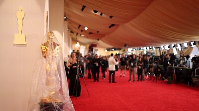An Oscar statue is covered in plastic as preparations continue for the 96th Academy Awards in Los Angeles, California, US. Reuters