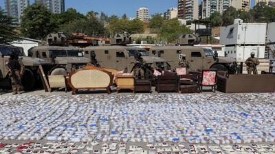 Lebanese security forces with bags of the confiscated drugs, including Captagon, in Beirut. EPA