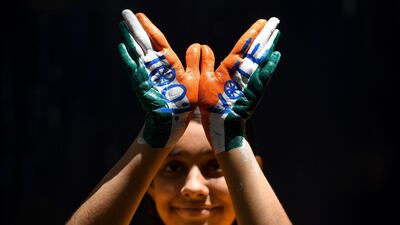 An Indian school student displays a painted hand during an election awareness campaign ahead of the second phase of India's general election in Chennai on April 12, 2019. AFP