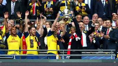 Lack of titles at the start of last season had put Arsene Wenger, right, and the Arsenal players under pressure, but a second FA Cup victory, defeating Aston Villa 4-0, in a row has changed that. Eddie Keogh / Reuters