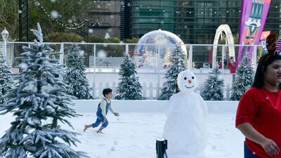 Daniel Shawky, 5, plays in The Galleria's Winter Wonderland snow park. Khushnum Bhandari / The National